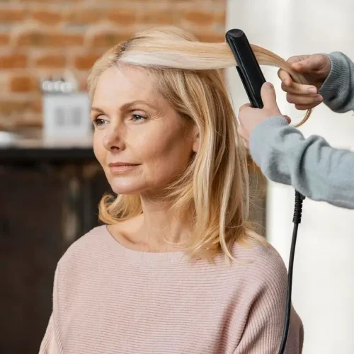 mature-woman-getting-her-hair-st